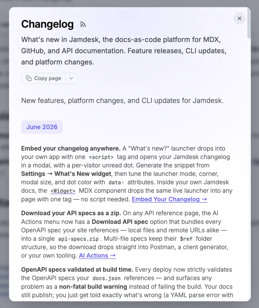 The What's new modal open over a dimmed app, showing the Jamdesk changelog page with a Copy page button and dated update entries, and a close button in the top corner
